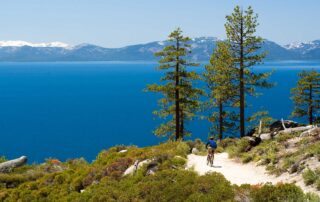 Mountain biker on a trail overlooking Lake Tahoe