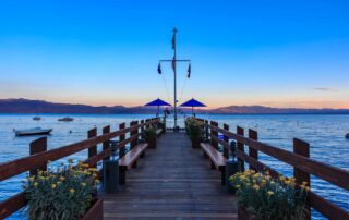 Dock on Lake Tahoe at sunset with flower pots